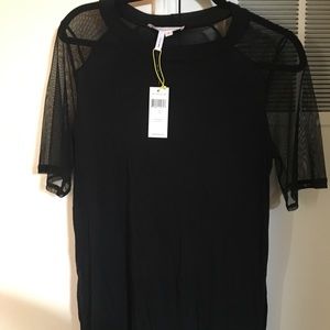BCBG Black shirt. Net sleeves. Tag still on